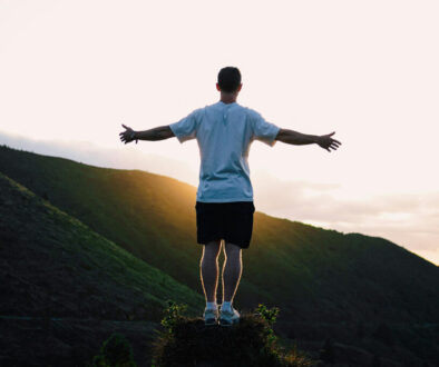 Man Standing against the Setting Sun