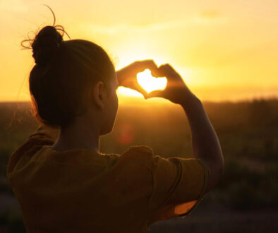 Womand doing heart shape with her hands